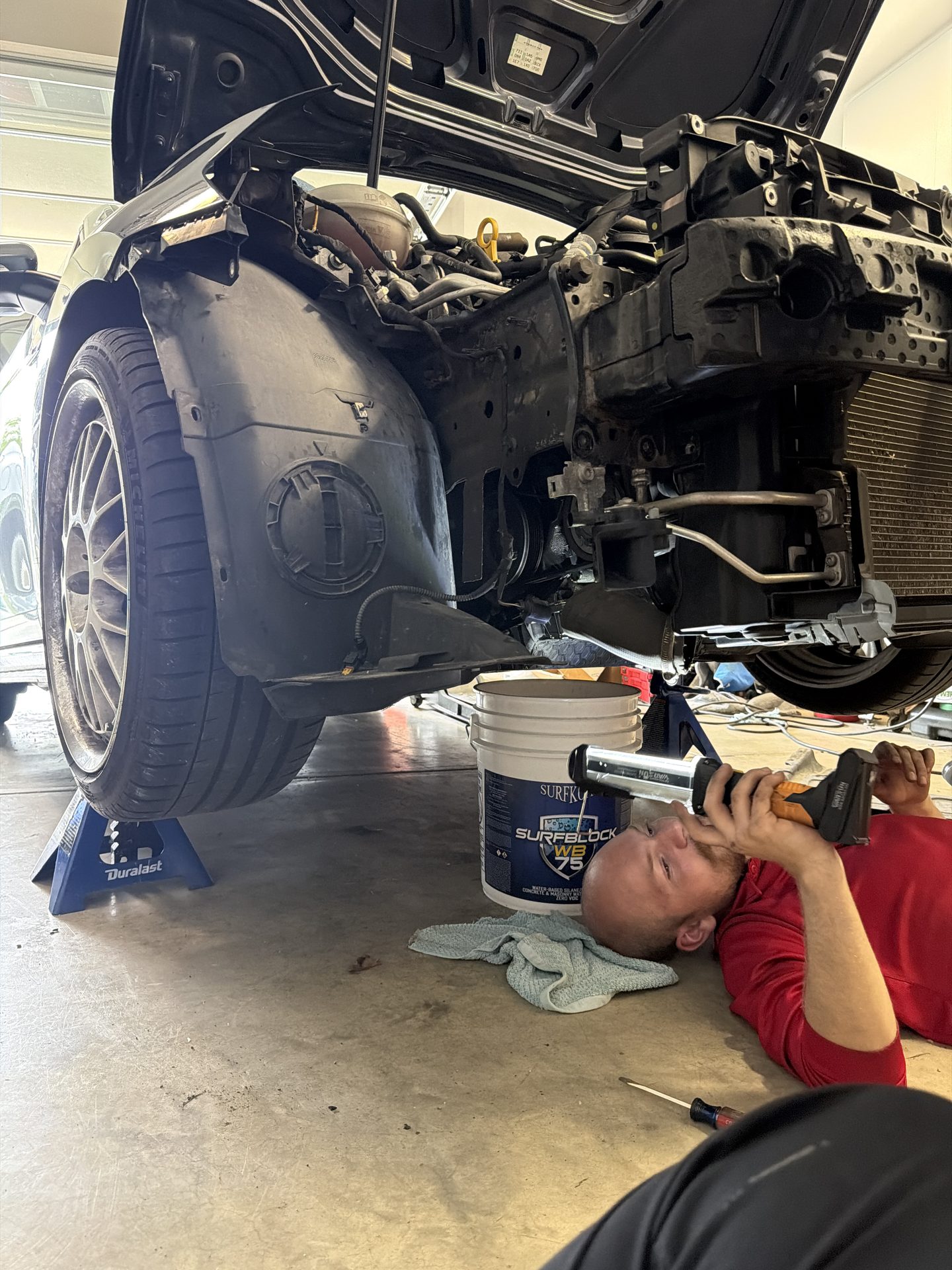 Mobile auto repair — under-car work at Hinton Motor Works